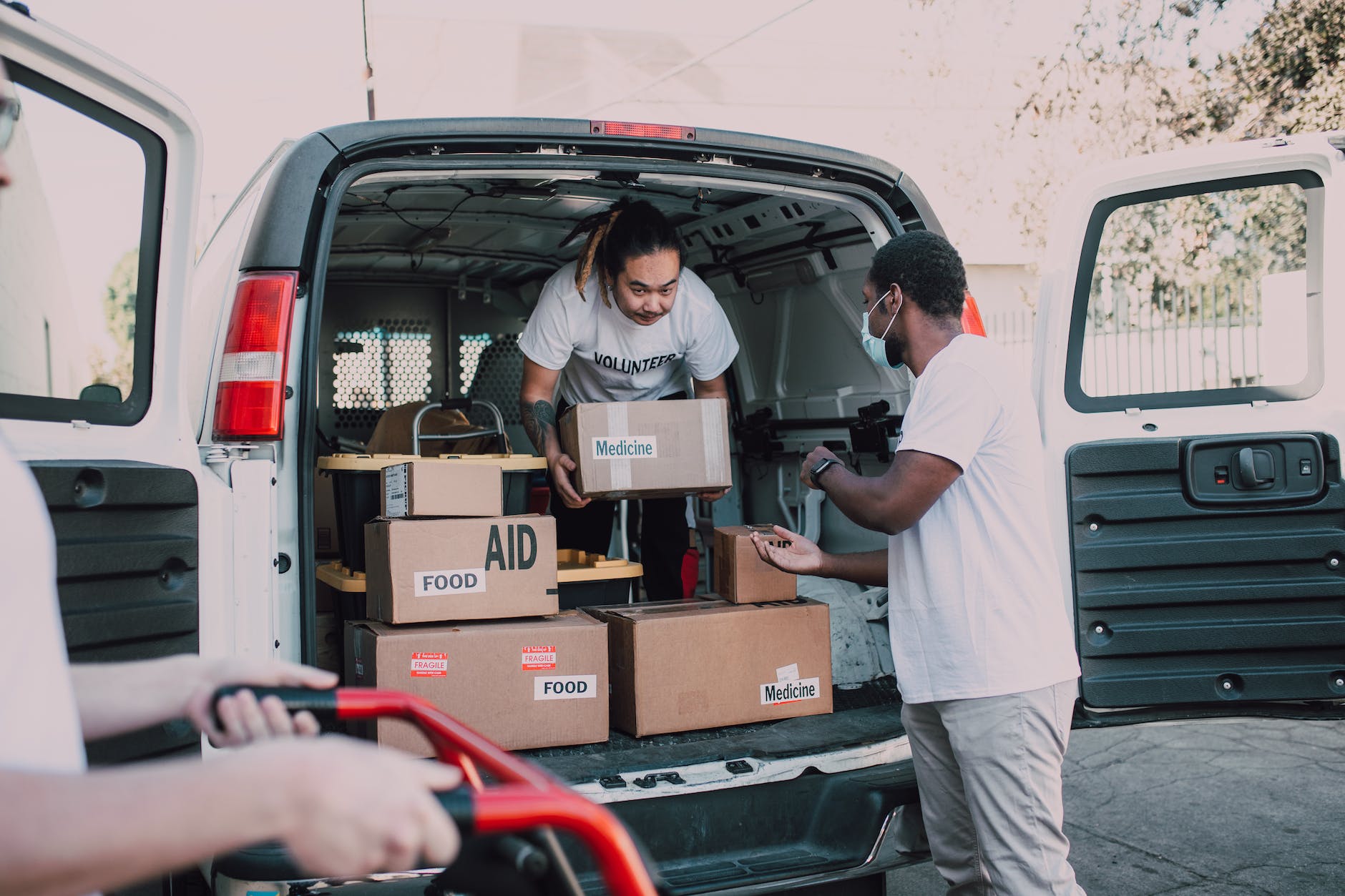 two men carrying boxes